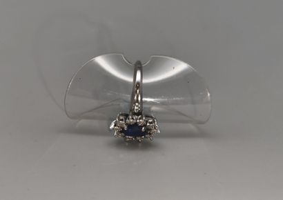 Daisy ring set with a sapphire in a surround...