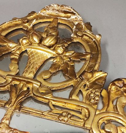 Louis XVI period carved and gilded wood mirror...
