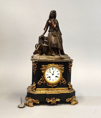 Black marble clock surmounted by an oriental-style...