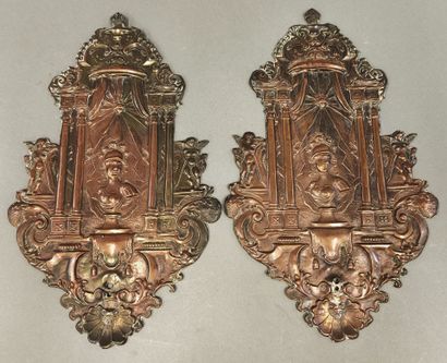 Pair of repoussé copper sconces decorated...