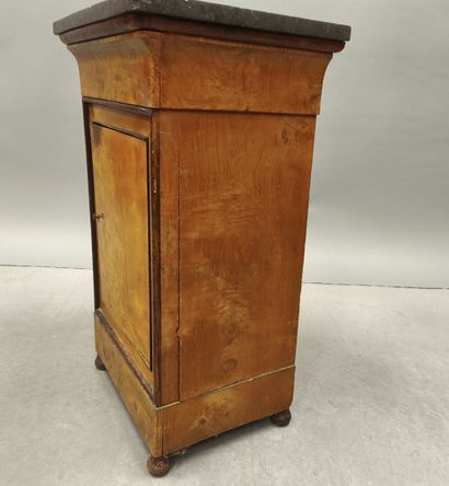 Burr wood night table opening with a door...