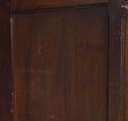 Gendarme-cap cabinet in molded walnut, opening...