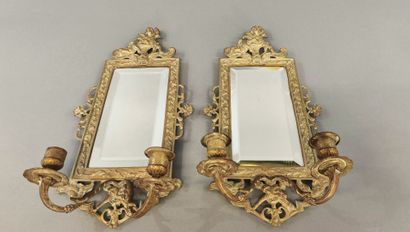 Pair of bronze two-light sconces with cherub...