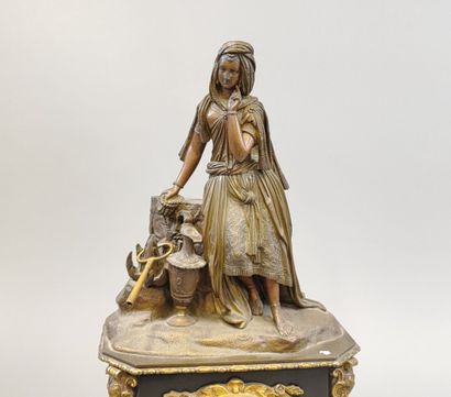Black marble clock surmounted by an oriental-style...