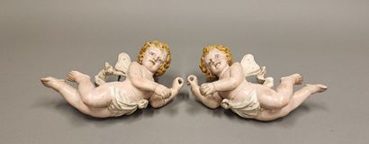 ITALY. Pair of cherubs in carved lacquered...