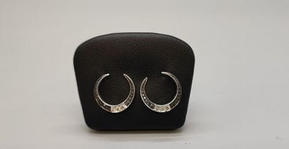 Pair of crescent-shaped earrings in white...