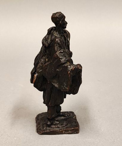 Gaston BROQUET (1880-1947). Woman with bundles
Brown...