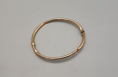 Yellow gold (750) openwork bangle with safety...