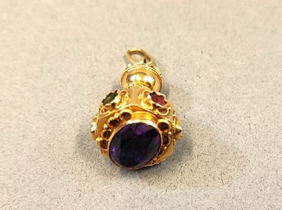 18K (750) gold pendant set with a large amethyst...