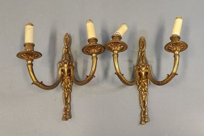 Pair of ormolu sconces decorated with ram...
