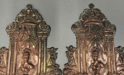 Pair of repoussé copper sconces decorated...