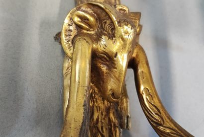 Pair of ormolu sconces decorated with ram...