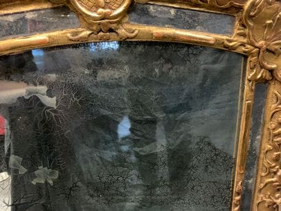 Gilded carved wood mirror with foliage and...