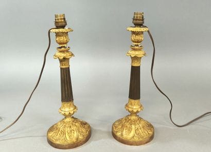 Pairs of ormolu and patinated brass candlesticks...