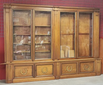 Mahogany veneered two-part bookcase opening...