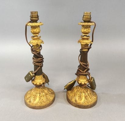 Pairs of ormolu and patinated brass candlesticks...