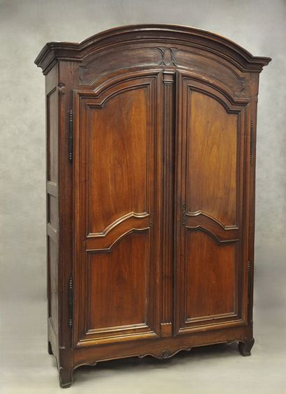 Gendarme-cap cabinet in molded walnut, opening...