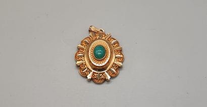 Gold pendant with oval medallion set with...