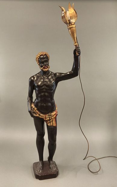 Painted and gilded wood torch holder featuring...