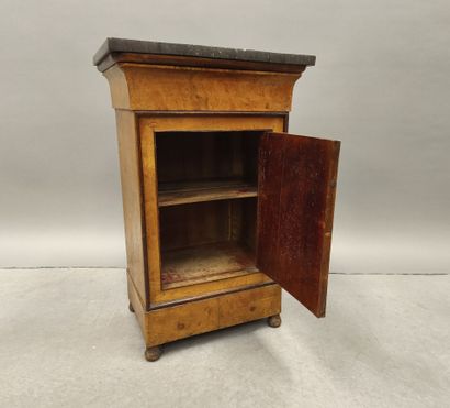 Burr wood night table opening with a door...