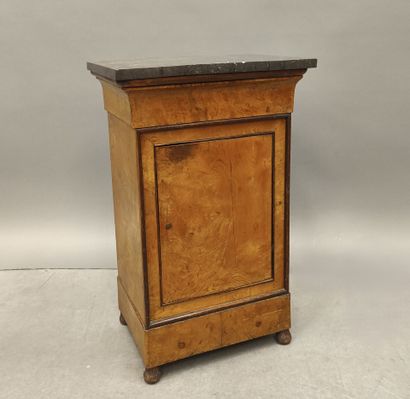 Burr wood night table opening with a door...