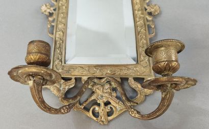 Pair of bronze two-light sconces with cherub...