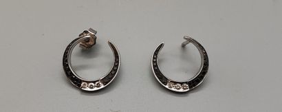Pair of crescent-shaped earrings in white...