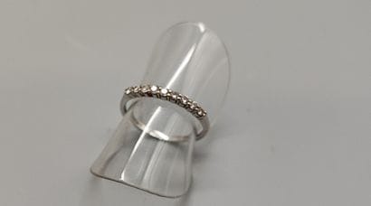 Half-American wedding band in white gold...