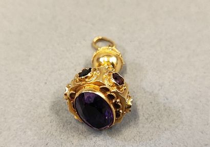 18K (750) gold pendant set with a large amethyst...
