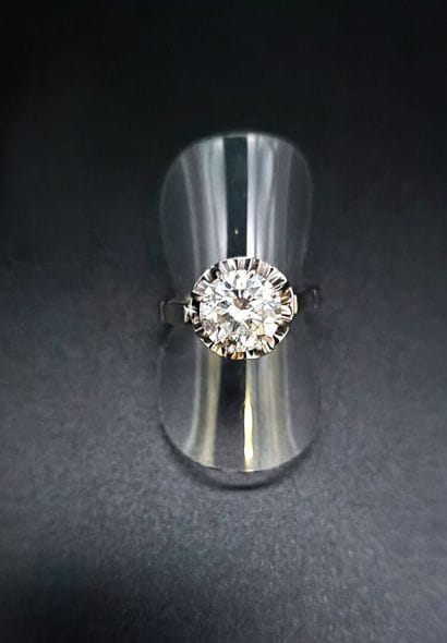 White gold solitaire set with a 2.2-carat...