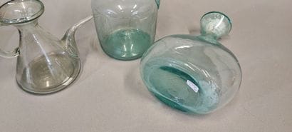 A shepherd's bottle in slightly bluish glass...