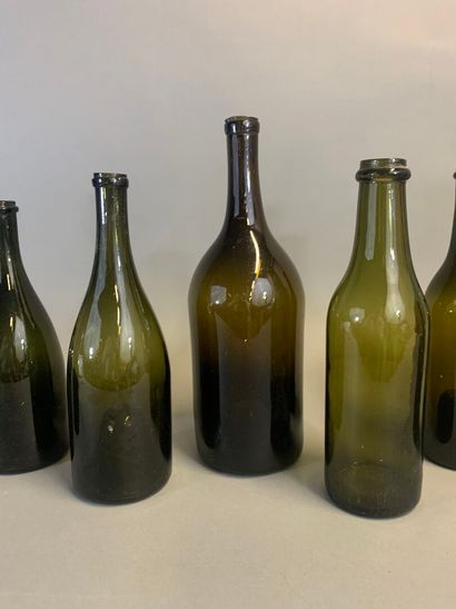 Seven antique bottles, mouth-blown olive...