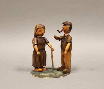 Couple de personnages articulés en bois sculpté...