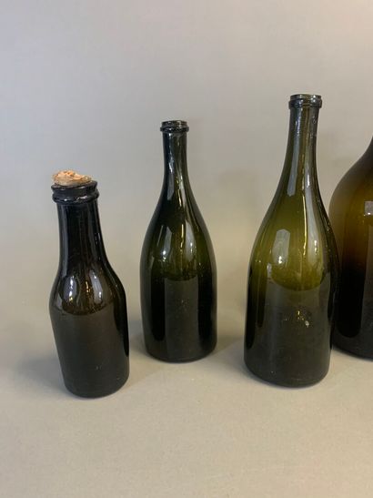 Seven antique bottles, mouth-blown olive...