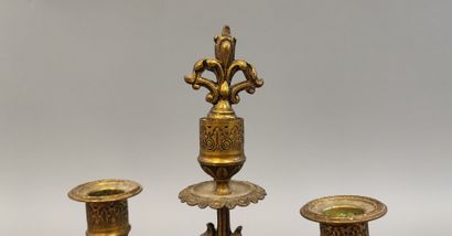 Pair of bronze three-light candlesticks decorated...