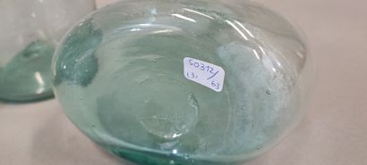 A shepherd's bottle in slightly bluish glass...