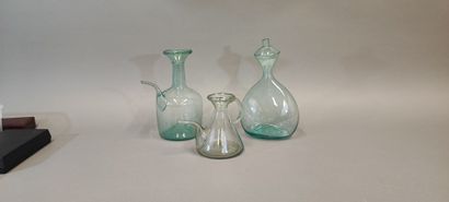 A shepherd's bottle in slightly bluish glass...