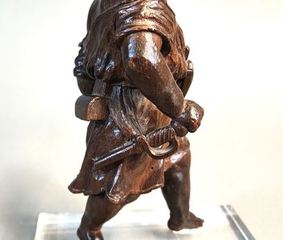 Putto with bugle. Wooden statuette carved...