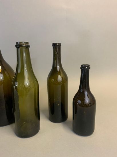 Seven antique bottles, mouth-blown olive...