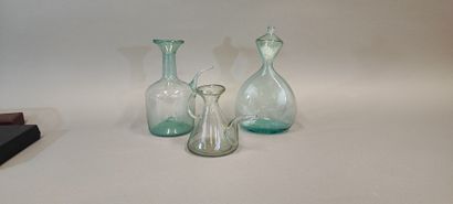 A shepherd's bottle in slightly bluish glass...