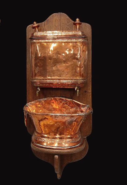 Copper fountain on wooden stand, with two...