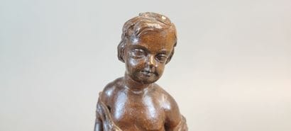 Putto with bugle. Wooden statuette carved...