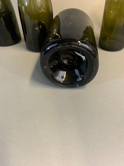 Seven antique bottles, mouth-blown olive...