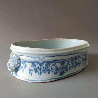NEVERS, 19th century
Oval planter with faded...