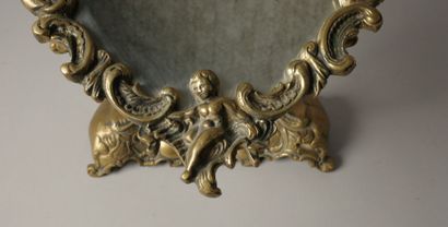 Psyché or table mirror in bronze with cherubs,...