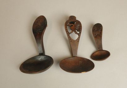 Set of four wooden cream scoops including:...