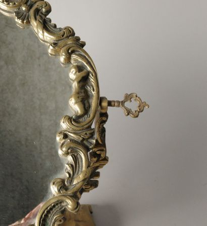 Psyché or table mirror in bronze with cherubs,...