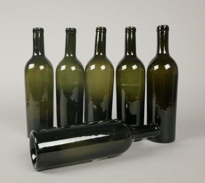Six Bordeaux-shaped bottles in glass of various...