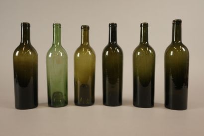 Six Bordeaux-shaped bottles in glass of various...