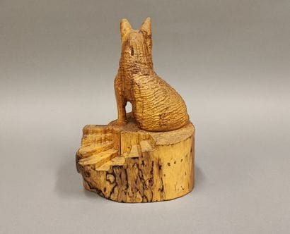 German Shepherd above the stairs in carved...